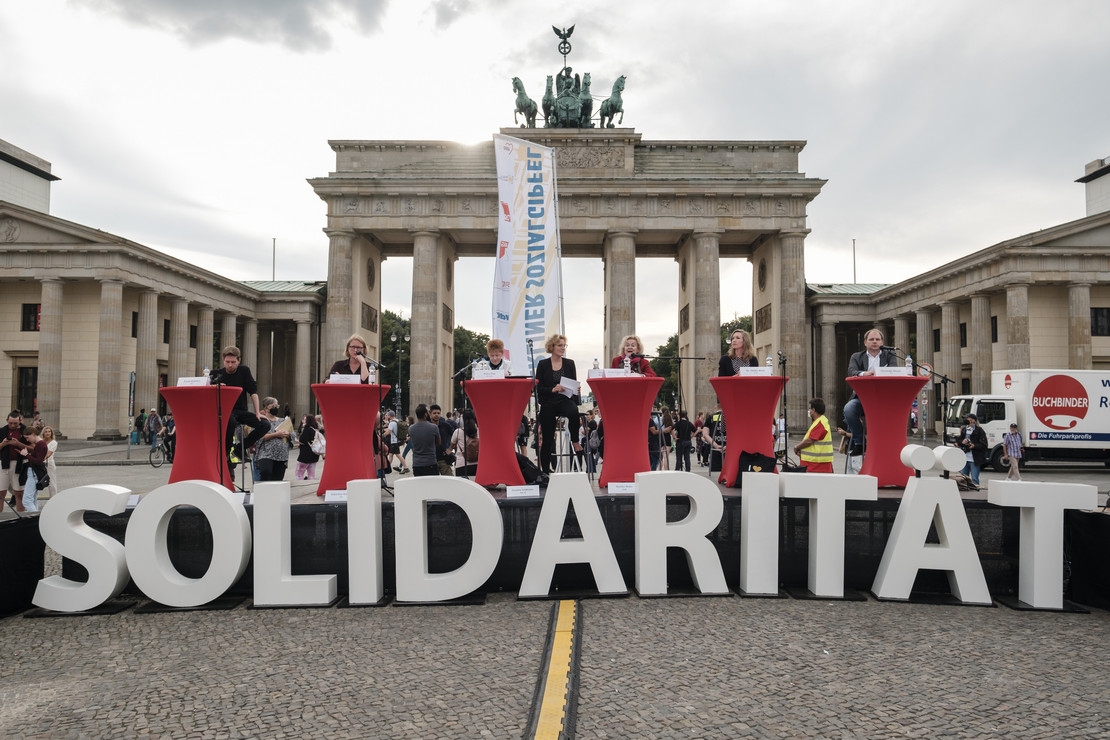 die Redner*innen am Podium